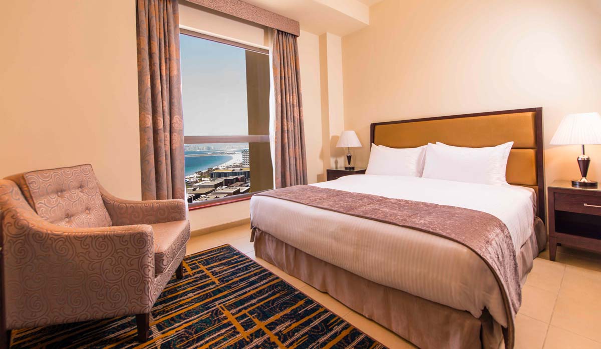 Comfortable and spacious bedroom with stunning views of the JBR Beach and Marina